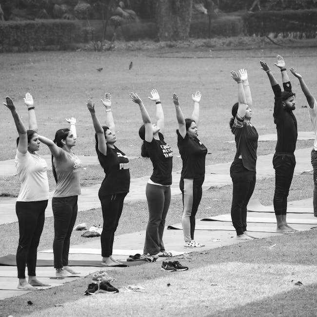 Group of people practicing yoga outdoors